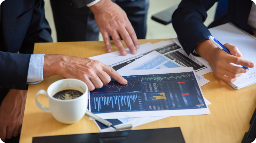 People reviewing investment plan documents